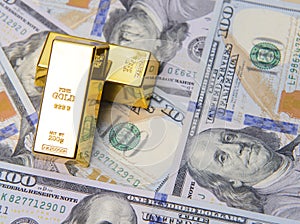 Two golds with new american hundred dollar bills photo