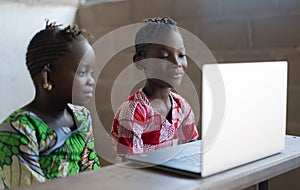 Two Gorgeous African Girls Watching Laptop Computer