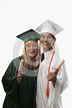 Two graduates in cap and gown