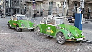 Two green antique car