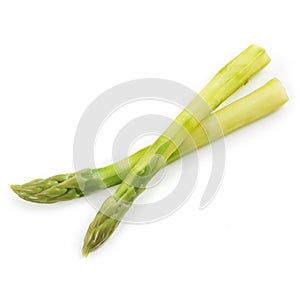 Two green asparagus isolated on a white background with shadow