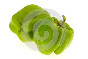 Two Green bell pepper isolated on white