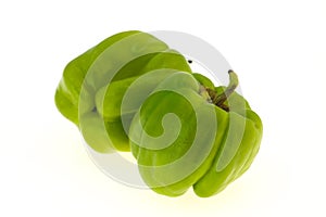 Two Green bell pepper isolated on white