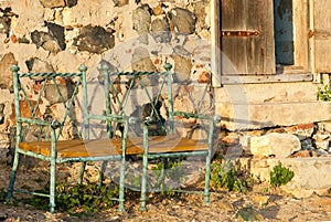 Two Green Chairs Outside an Abandoned Hut on Fort