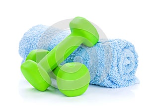 Two green dumbells and towel photo