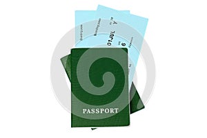 Two green passports, blue boarding pass, flight tickets white background isolated close up top view, airplane travel, holidays