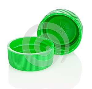 Two green plastic lids