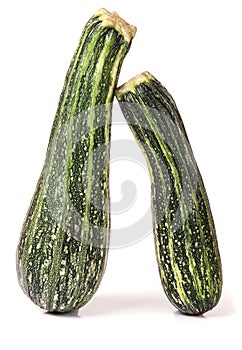 Two green zucchini isolated on white background