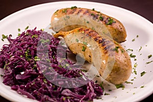 Two grilled bavarian sausage with cauliflower