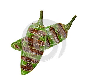 Two grilled jalapeno chili pepper isolated on white background