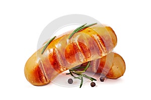 Two grilled sausages with rosemary and pepper on white background