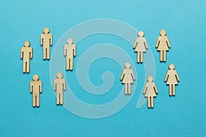 Two groups of male and female figures on a blue background