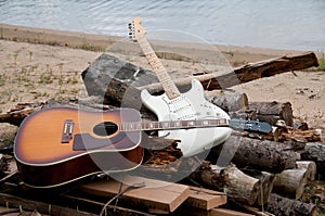 Two guitars on the beach