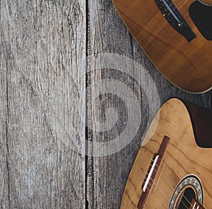 two guitars on wood with nature background, vintage photo