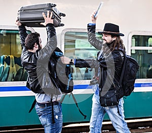 Two guys are fighting because they missed their train.