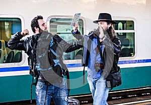 Two guys are fighting because they missed their train.