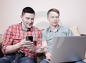 Two guys with gadgets