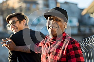 Two guys joking and laughing on the street photo