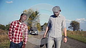 Two guys left broken car and hitchhiking.