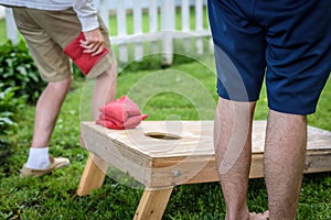 two guys playing game of bags