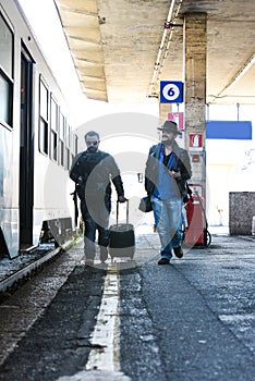 Two guys are searching for their train.