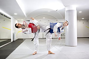 Two guys in a taekwondo combat