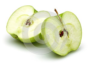 Two half green apples isolated on white