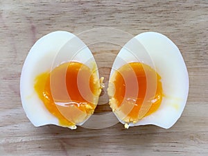 Two half of medium boiled eggs, top view