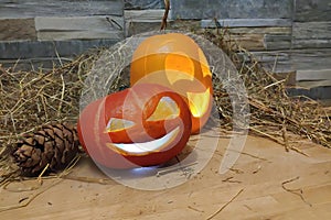 Two halloween jack o lanterns yellow and red on foreground on a hay and brick wall background. with cones on wooden stand