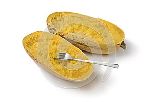 Two halved cooked spaghetti squashes