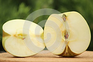 Two halves of an apple of the Zarya Alatau variety