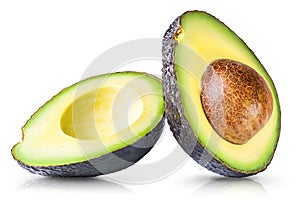 Two halves of avocado with kernel isolated on white background
