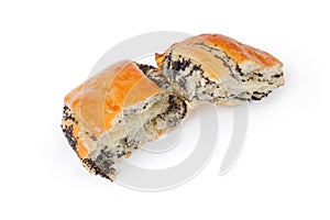 Two halves of the broken small poppy seed roll