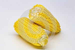 Two halves ear of ripe sweet corn isolated on white background. Isolated. Package design element. Sweet corn without husk