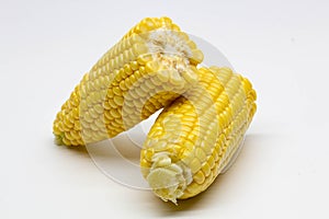 Two halves ear of ripe sweet corn isolated on white background. Isolated. Package design element. Sweet corn without husk