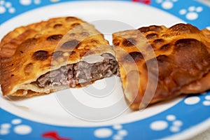 Two halves of meat pie