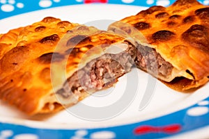 Two halves of meat pie