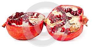 Two halves of pomegranate on white background