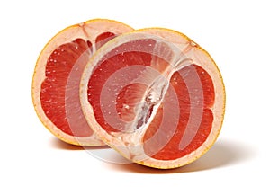Two halves of red grapefruit