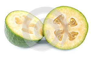 Two halves of the ripe feijoa fruit are isolated on a white background