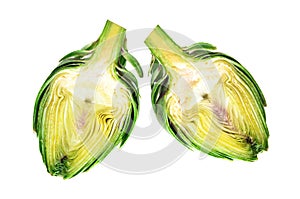 Two halves of ripe green artichokes on a white background