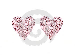 Two hand drawn hearts in red ink on white