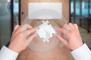 Two hand holding connecting piece jigsaw puzzle, Business connection, success and strategy concept.