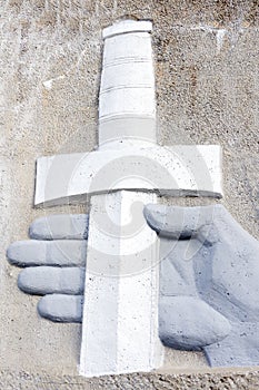 Two-handed sword hangs on the wall hand .