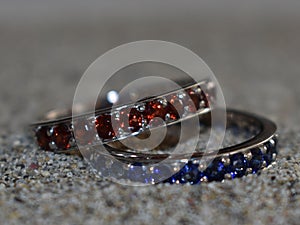 Two handmade blue and red wedding rings