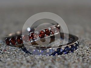 Two handmade blue and red wedding rings