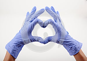 Two hands in blue gloves