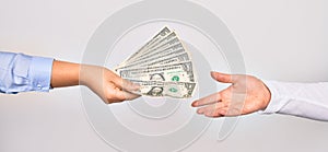 Two hands of caucasian young women doing transaction