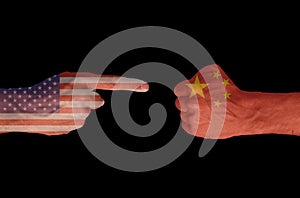 Two hands in discussion pose with USA and China flags overprinted on black background