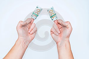 Two hands and dollars  on white backgrounds